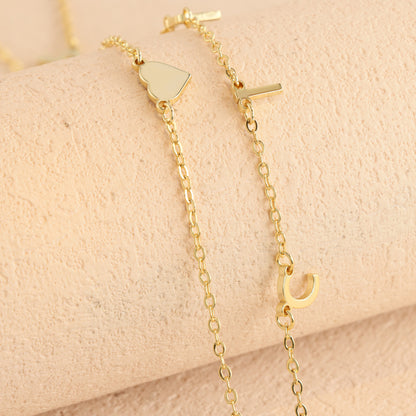 Elegant stainless steel O-ring chain with heart and letter pendant