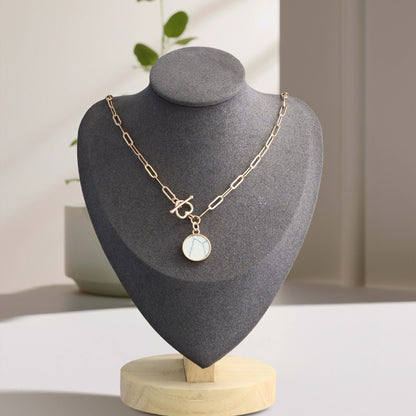 Cross Chain Necklace with Geometric Circular Pendant
