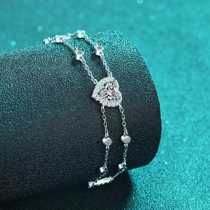 Princess Celestial Bracelet: Choose 1ct Moissanite, 1ct Blue Moissanite, or 6.5mm Heart Zircon. Set in rhodium-plated sterling silver.