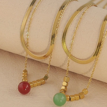 Multi-layered Serpentine Bone Necklace with Natural Stone Pendant
