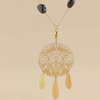 Black natural stone beads and metal tassel cross necklace